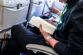 attendence passenger read book on the plane seat Royalty Free Stock Photo