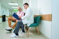 Attending physician conducts a survey of the patient