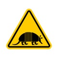 Attention armadillo. Caution Nine-hip Armadillo. Yellow triangle road sign Royalty Free Stock Photo