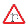 Attention Construction site. Caution development. Red road triangle sign Lifting crane
