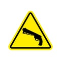 Attention crime. Gun in yellow triangle. Road sign Caution Weapon Royalty Free Stock Photo