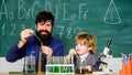 Attention deficit hyperactivity disorder. Teacher child test tubes. School lesson. Chemical experiment. Difficult focus Royalty Free Stock Photo