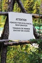 Attention fenced are for ecological restoration sign