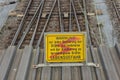 Attention high voltage sign train tracks in german language