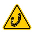 Attention Horseshoe. Caution Good luck symbol. yellow triangle road sign