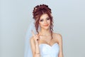 Attention listen to me. Close up portrait of young bride spouse woman showing attention be careful hand gesture isolated on light