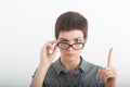 Attention, listen to me. Close up portrait of young woman wagging her finger on the white background. Negative human