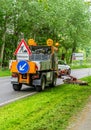 Attention mowing roadside Royalty Free Stock Photo