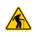Attention pensioner. Warning yellow road sign. Caution Old man Royalty Free Stock Photo