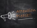 Attention Please text with megaphone on chalkboard background Royalty Free Stock Photo