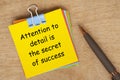 Attention to details is the secret of success text on yellow notepad. Encouragement concept.