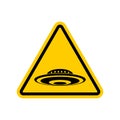 Attention UFO. Caution unknown flying objec. Yellow triangle road sign Royalty Free Stock Photo