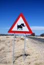 Attention warthogs crossing, road sign in Namibia Royalty Free Stock Photo