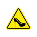 Attention woman. yellow prohibitory road sign women`s shoes.