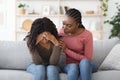 Attentive african american lady comforting her upset friend Royalty Free Stock Photo