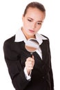 Attentive business woman with loupe