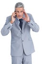 Attentive businessman answering phone Royalty Free Stock Photo