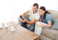 Attentive couple playing video game together