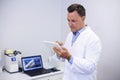 Attentive dentist using digital tablet