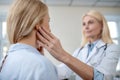 Attentive doctor touching his fingers to patients head