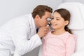 Attentive ent physician examining ear of