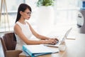 Attentive executive using laptop at desk Royalty Free Stock Photo