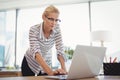 Attentive executive using laptop at desk Royalty Free Stock Photo