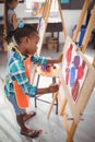 Attentive girl panting on canvas