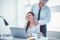 Attentive handsome boss making massage to employee