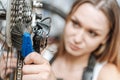 Attentive hardworking technician brushing the chain of the bicycle