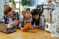 Attentive little engineers checking process of creating 3d-models Royalty Free Stock Photo