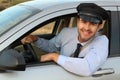 Attentive looking professional driver smiling Royalty Free Stock Photo