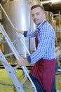 Attentive maintained worker working at brewery Royalty Free Stock Photo
