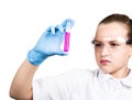 Attentive schoolgirl conducting a chemistry experiment at elementary science class Royalty Free Stock Photo