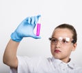 Attentive schoolgirl conducting a chemistry experiment at elementary science class Royalty Free Stock Photo