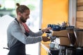 Attentive waiter making cup of coffee