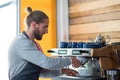 Attentive waiter making cup of coffee