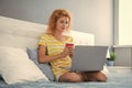 attentive woman freelancer with coffee work at home on laptop. freelancer woman work at home.