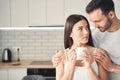 Attentive young husband hugging his wife at home Royalty Free Stock Photo