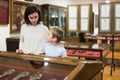 Woman and boy exploring artworks in museum