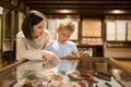 Woman and boy exploring artworks in museum