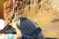 Attenuation tank made of big diameter plastic pipe delivered on construction site, offloaded and moved by an excavator into Royalty Free Stock Photo