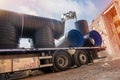 Attenuation tank made of big diameter plastic pipe delivered on construction site by truck and offloaded Royalty Free Stock Photo