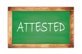 ATTESTED text written on green school board Royalty Free Stock Photo