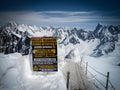 Attetion sign label in Vallee Blanche, Chamonix, France in summer Royalty Free Stock Photo