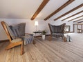 The attic floor with a seating area with designer chairs and a l