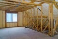 Attic with foam insulation frame house in process of in unfinished under construction Royalty Free Stock Photo