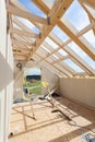 Attic room under construction with gypsum plaster boards. Roofing Construction Indoor. Wooden Roof Frame House Construction Royalty Free Stock Photo