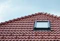 Attic skylight window on red ceramic tiles house roof outdoor. Attic Skylights Home Design Ideas Exterior. Royalty Free Stock Photo