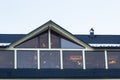 Attic skylight window wall. Building Modern House Construction with metal roof, rain gutter system and roof protection from snow Royalty Free Stock Photo